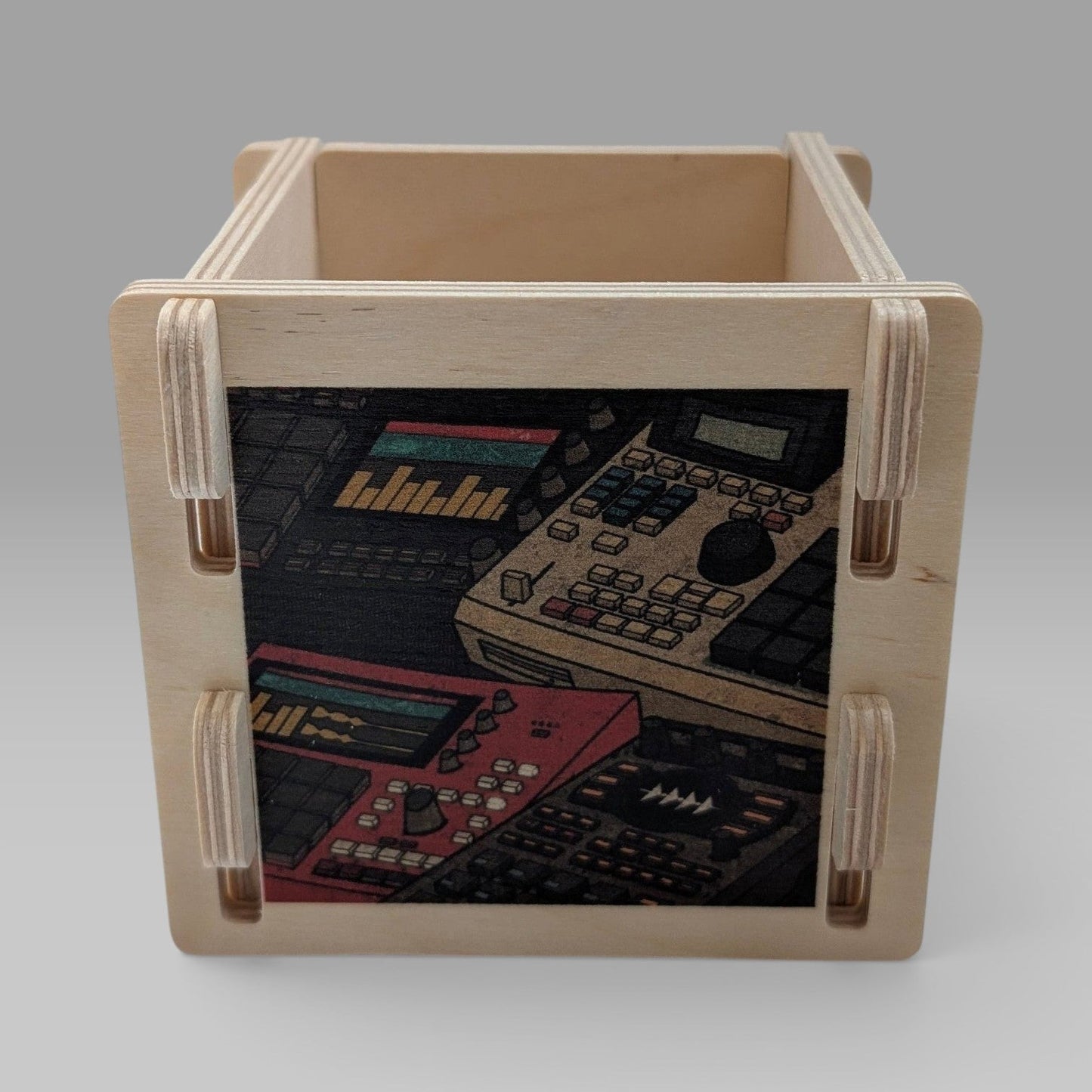 wooden accessory box featuring classic samplers and drum machines
