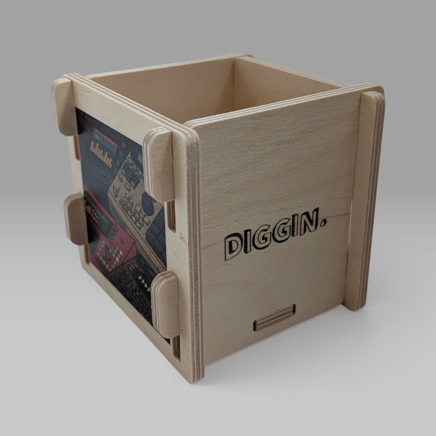 wooden accessory box featuring classic samplers and drum machines